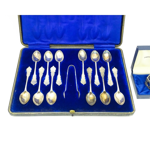 638 - A cased set of twelve silver plate teaspoons with sugar tongs en suite. The case marked Jeweller & W... 