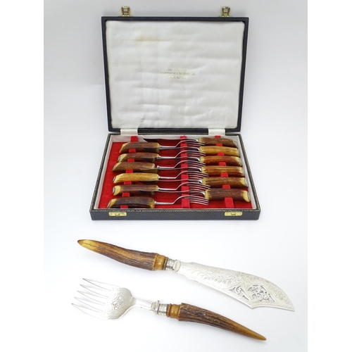 639 - A cased set of antler handled steak knives and forks. Retailed by Fortnum & Mason. Together with ant... 