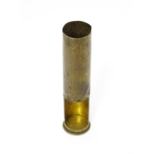 A vesta case converted from a brass shotgun cartridge case, with