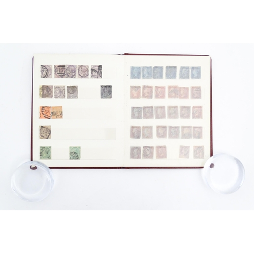 1999 - A stamp album containing a quantity of British postage stamps, including Victorian examples: Penny B... 