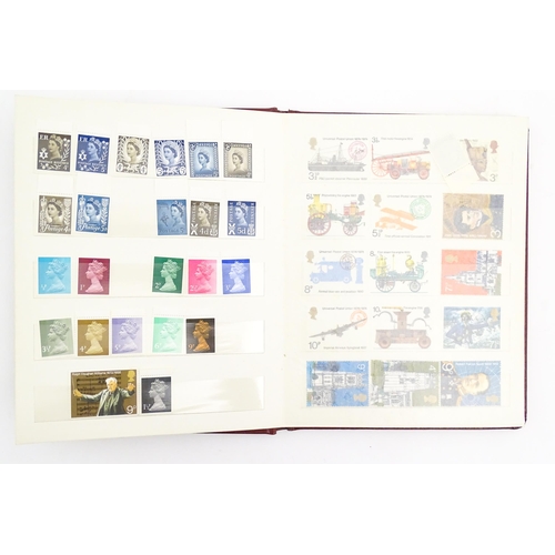 1999 - A stamp album containing a quantity of British postage stamps, including Victorian examples: Penny B... 