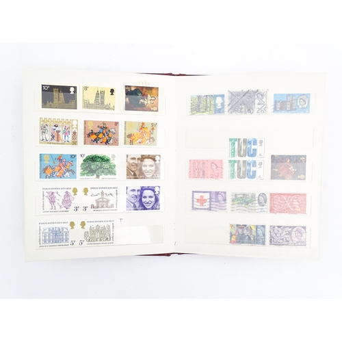 1999 - A stamp album containing a quantity of British postage stamps, including Victorian examples: Penny B... 