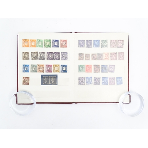 1999 - A stamp album containing a quantity of British postage stamps, including Victorian examples: Penny B... 