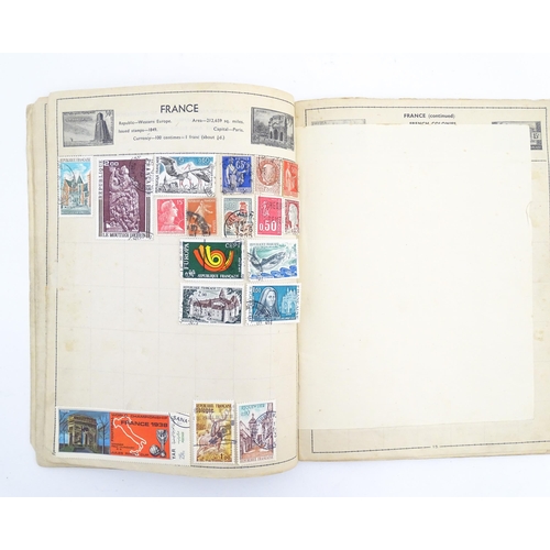 2000 - A 'Cromwell World's Stamp Album', containing a quantity of British and worldwide postage stamps, tog... 