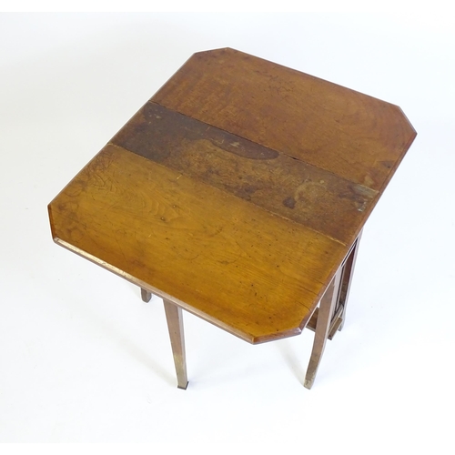 22 - An early 20thC mahogany Sutherland table with two canted leaves, slatted sides and raised on splayed... 