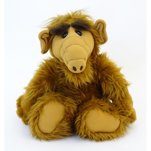 32 - Toy: A 20thC Talking Alf plush toy with cassette player and tape to back, produced by Alien Producti... 