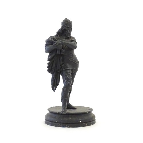 34 - A 20thC spelter sculpture modelled as a medieval king. Raised on a turned wooden base. Approx. 15 3/... 