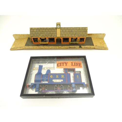 62 - Toys: A 20thC scratch built wooden model railway station / platform with various adverts for Shell, ... 