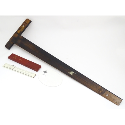 106 - Two artist's tools comprising an early 20thC wooden T-square by Winsor & Newton Ltd., and a George R... 