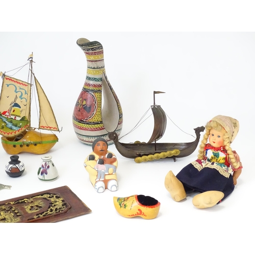 174 - A quantity of assorted miscellaneous items to include dolls, a novelty lamp modelled as a boat made ... 