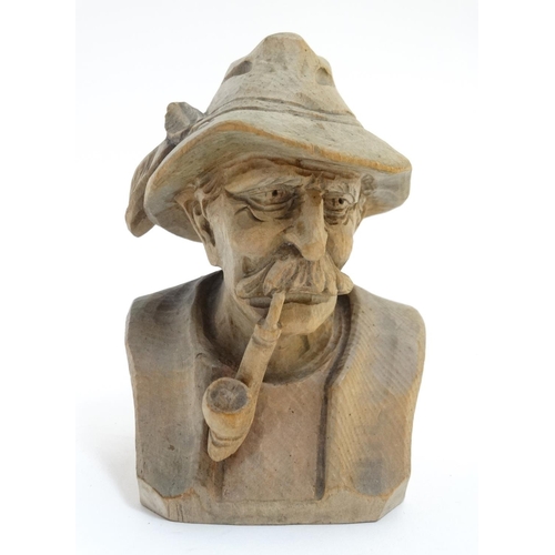 344 - A Continental carved model of a Tyrolean gentleman smoking a pipe. Approx 4 3/4'' high