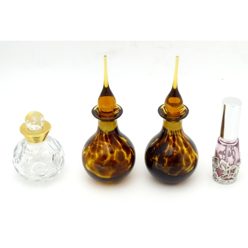 355 - Four assorted glass scent / perfume bottles. The tallest approx. 6