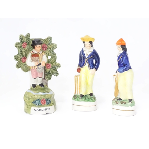 356 - Three 20thC Staffordshire pottery figures, to include two cricketers and a figure titled Gardener (3... 