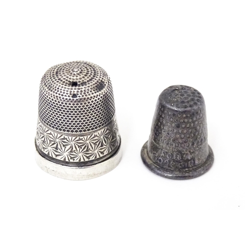 377 - Two white metal thimbles, one titled ' For a good girl  (2)