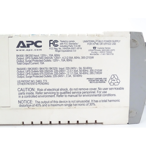 142 - An APC CS500 battery back up and surge protector, with instruction booklet. Approx 11