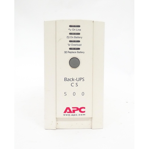 142 - An APC CS500 battery back up and surge protector, with instruction booklet. Approx 11