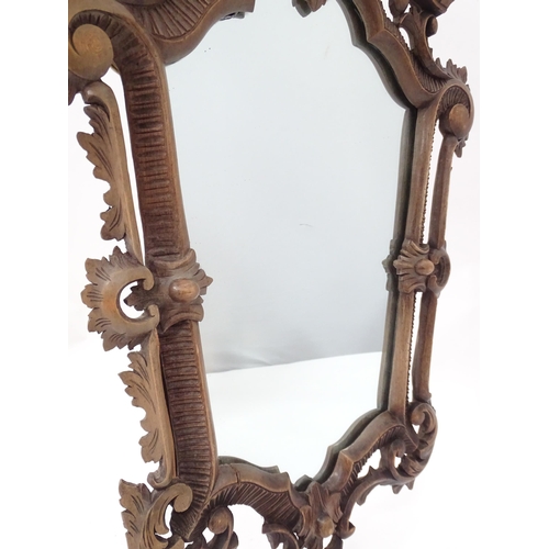 179 - A 20thC wall mirror with ornate frame, approx 22 1/2