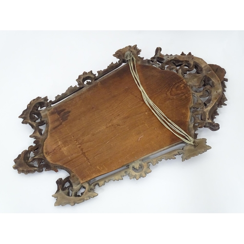 179 - A 20thC wall mirror with ornate frame, approx 22 1/2