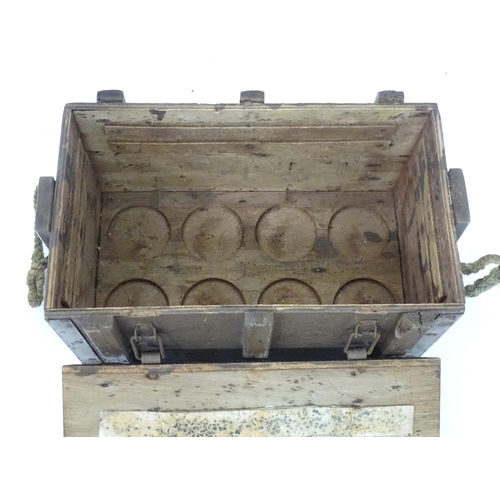 18 - Militaria : a post-WWII wooden ammunition crate, the interior with base sections to fit eight jet en... 