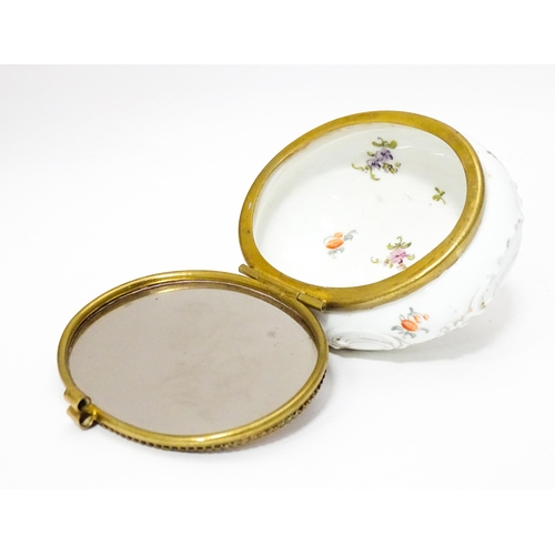 350 - A Continental ceramic pot and cover with mirror to interior, the hinged lid decorated with putti amo... 