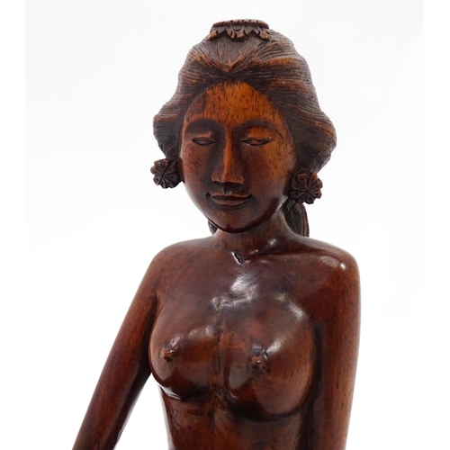 112 - A carved wooden model of a seated nude. Approx. 11 3/4