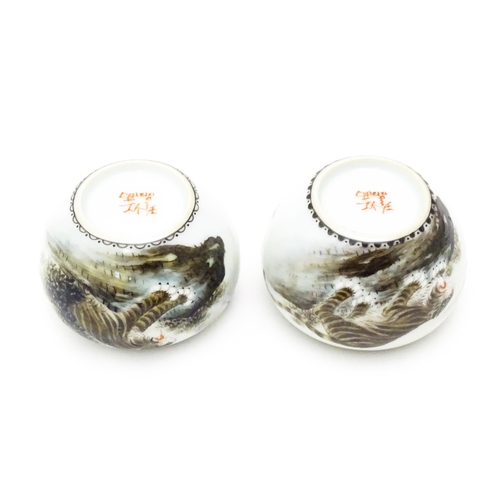 353 - A pair of Oriental ceramic salts with tiger decoration and Character script. Character marks under. ... 