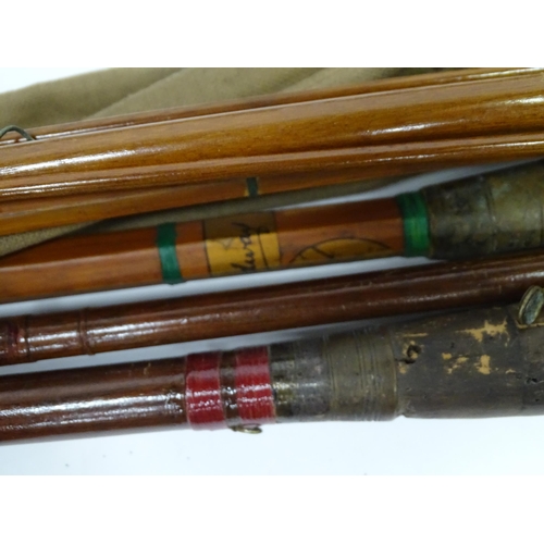 A quantity of vintage fishing rods, comprising: a greenheart 3-piece 15 1/2 salmon  rod by J. Enright