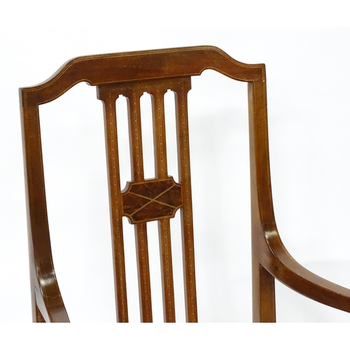 7 - A Regency period mahogany side chair together with an Edwardian mahogany elbow chair with satinwood ... 