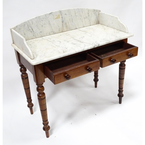 29 - A late 19thC marble topped table wash stand, the base with two drawers, standing approx 36