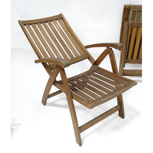 835 - Two teak garden chairs, with cushions