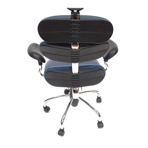 836 - An Italian blue swivel office chair. Bearing label under 'Lamm Spa'.