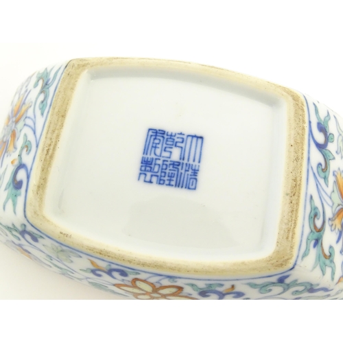 25A - A Chinese Doucai dish of rectangular form with scrolling floral and foliate decoration. Character ma... 