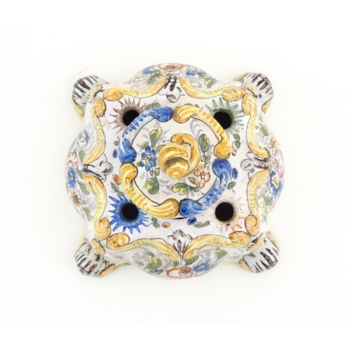 85 - A Continental faience inkwell of shaped form with hand painted floral and foliate decoration. Approx... 