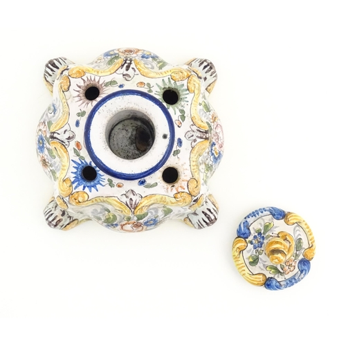 85 - A Continental faience inkwell of shaped form with hand painted floral and foliate decoration. Approx... 