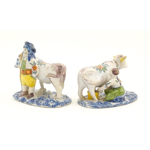 86 - Two French Quimper style faience figural models comprising cow and milk maid, and man with cow. Larg... 