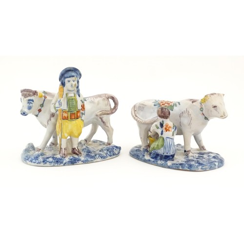 86 - Two French Quimper style faience figural models comprising cow and milk maid, and man with cow. Larg... 