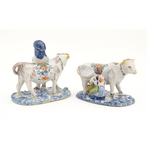 86 - Two French Quimper style faience figural models comprising cow and milk maid, and man with cow. Larg... 