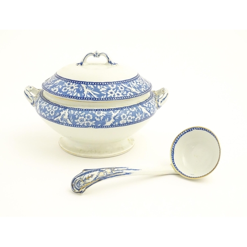 153 - A Wedgwood & Co. blue and white soup tureen and ladle with transfer decoration in
the Hawthorn patte... 