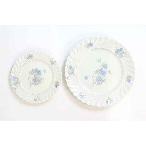 169 - A quantity of Haviland Limoges dinner wares in the Bergere pattern to include plates, serving dishes... 