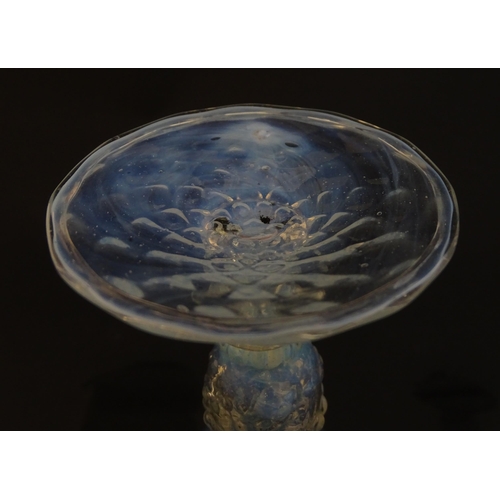 202 - A Venetian glass goblet / pedestal drinking glass with vaseline detail. Approx 6 3/4