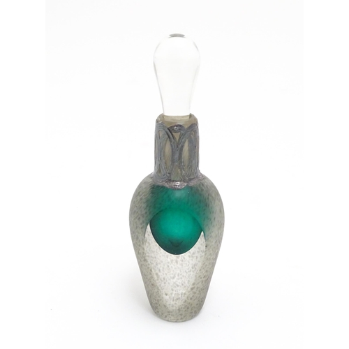 204 - A scent / perfume bottle with green detail and silver overall decoration to neck by Sileda Ltd. Appr... 