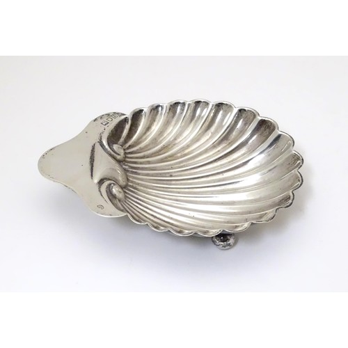 326 - A silver butter dish of shell form. Hallmarked London 1915 maker Josiah Williams & Co (David Landsbo... 