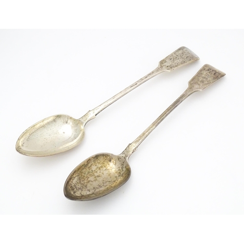 265 - A pair of Geo III silver fiddle pattern basting / serving spoons. Hallmarked London 1819 maker J.W a... 