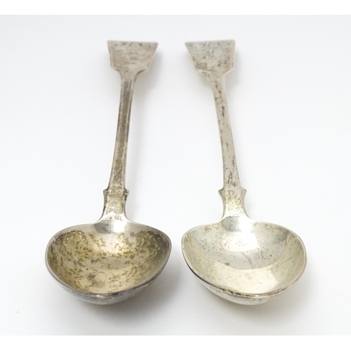 265 - A pair of Geo III silver fiddle pattern basting / serving spoons. Hallmarked London 1819 maker J.W a... 