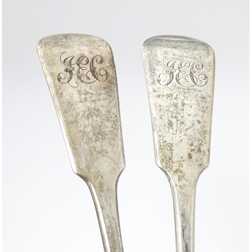 265 - A pair of Geo III silver fiddle pattern basting / serving spoons. Hallmarked London 1819 maker J.W a... 