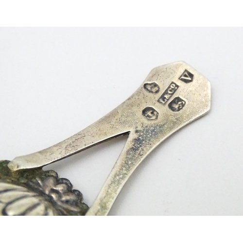 266 - A Geo III silver caddy spoon with engraved decoration and bifurcated handle . Hallmarked Birmingham ... 