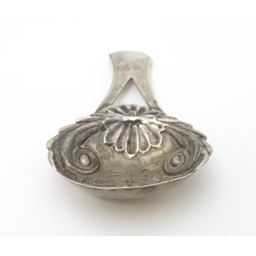 266 - A Geo III silver caddy spoon with engraved decoration and bifurcated handle . Hallmarked Birmingham ... 