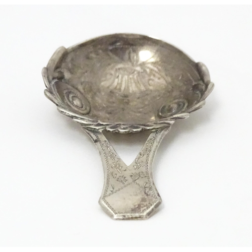 266 - A Geo III silver caddy spoon with engraved decoration and bifurcated handle . Hallmarked Birmingham ... 