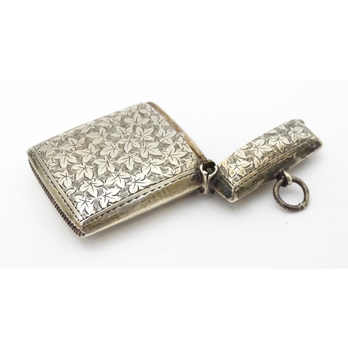 267 - A silver vesta case with engraved foliate detail. Hallmarked Birmingham 1901 maker Minshull & Latime... 