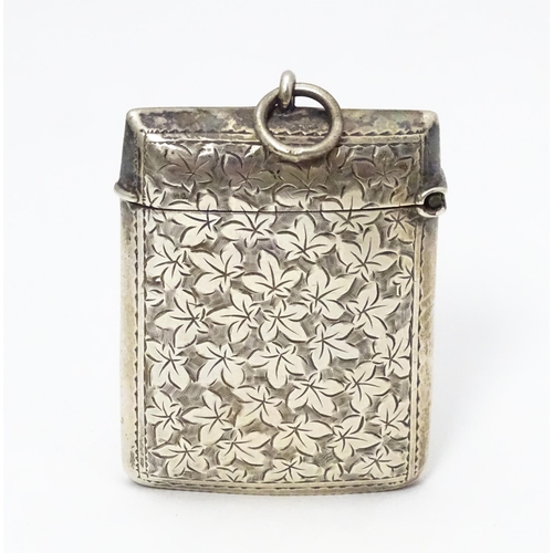 267 - A silver vesta case with engraved foliate detail. Hallmarked Birmingham 1901 maker Minshull & Latime... 